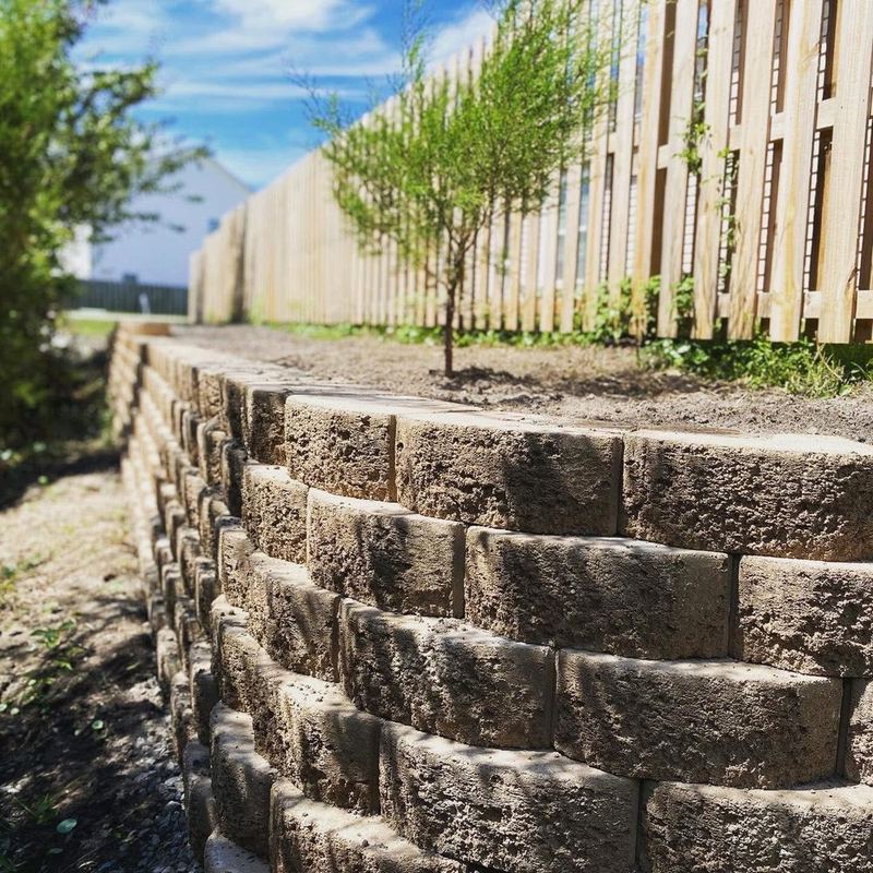 New wood picket fence and retaining wall